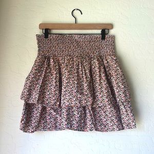 Flowy skirt with ruche waist. Comes down to mid thigh.